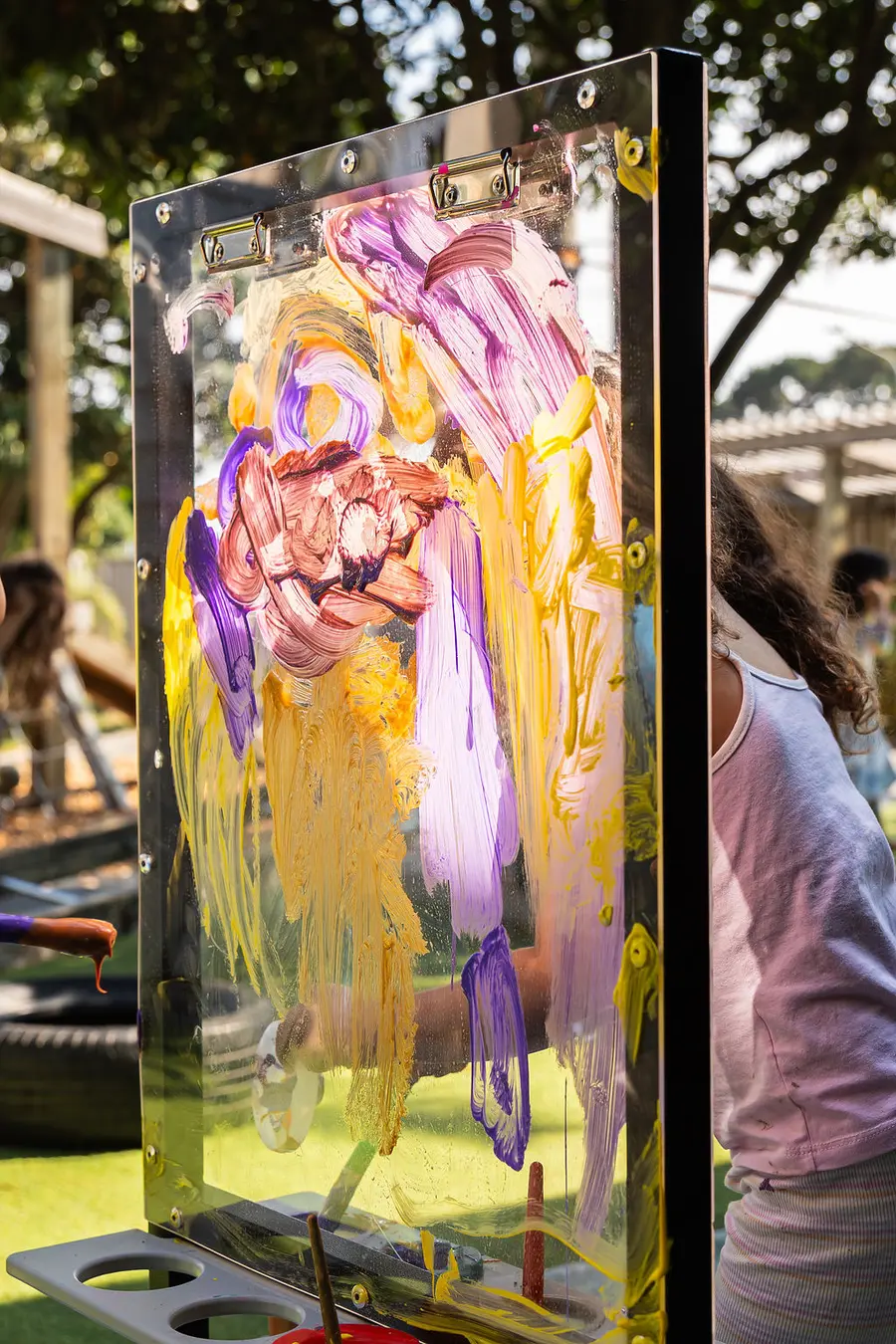 Easel set up outdoors at a preschool